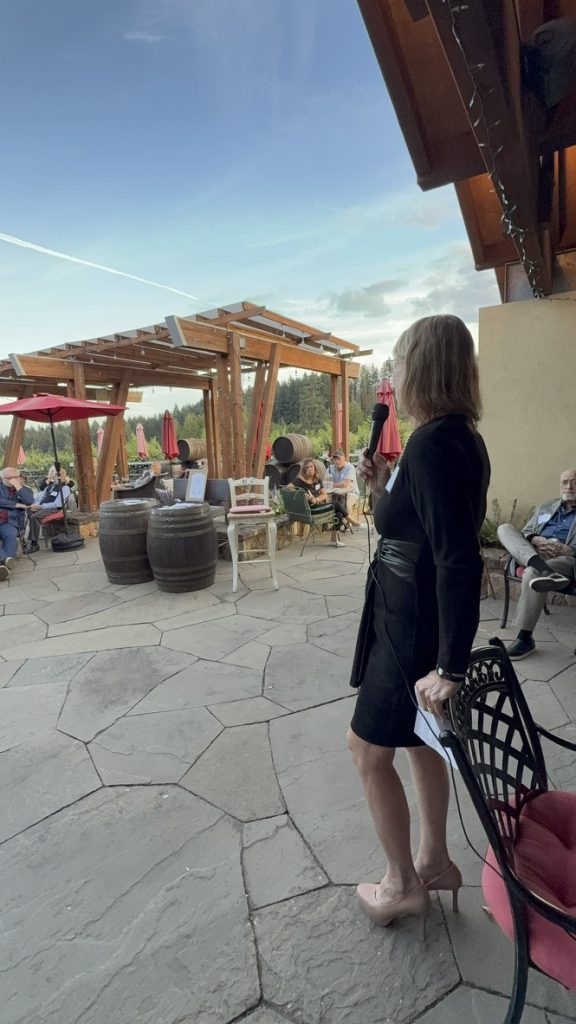 Speaker and guests gathered on a patio
